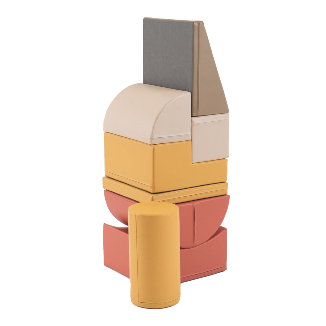 Stacked tower formation built from Adventurer beige and pink soft play blocks