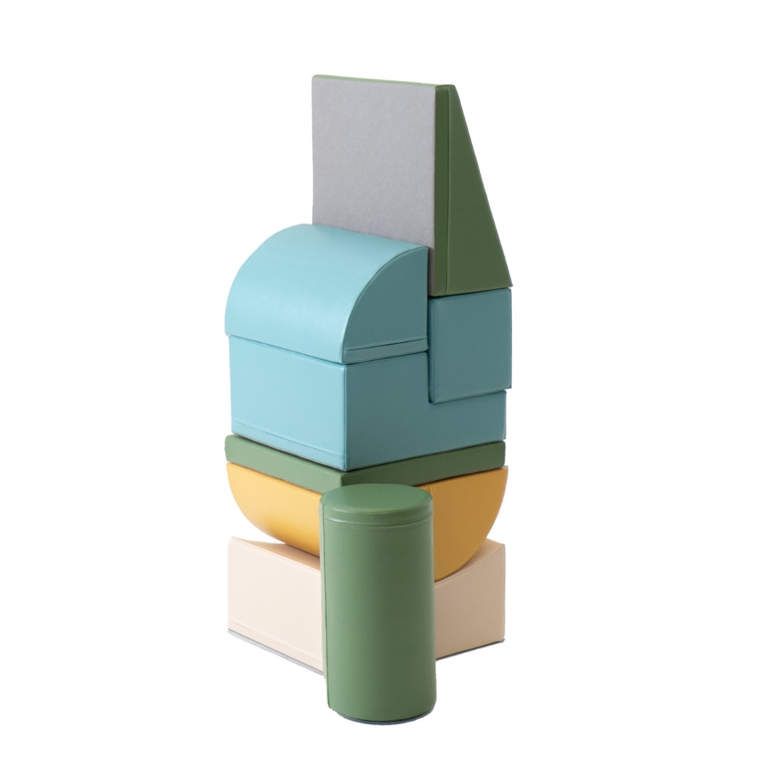 Tall stacked structure built from Adventurer beige and turquoise foam blocks