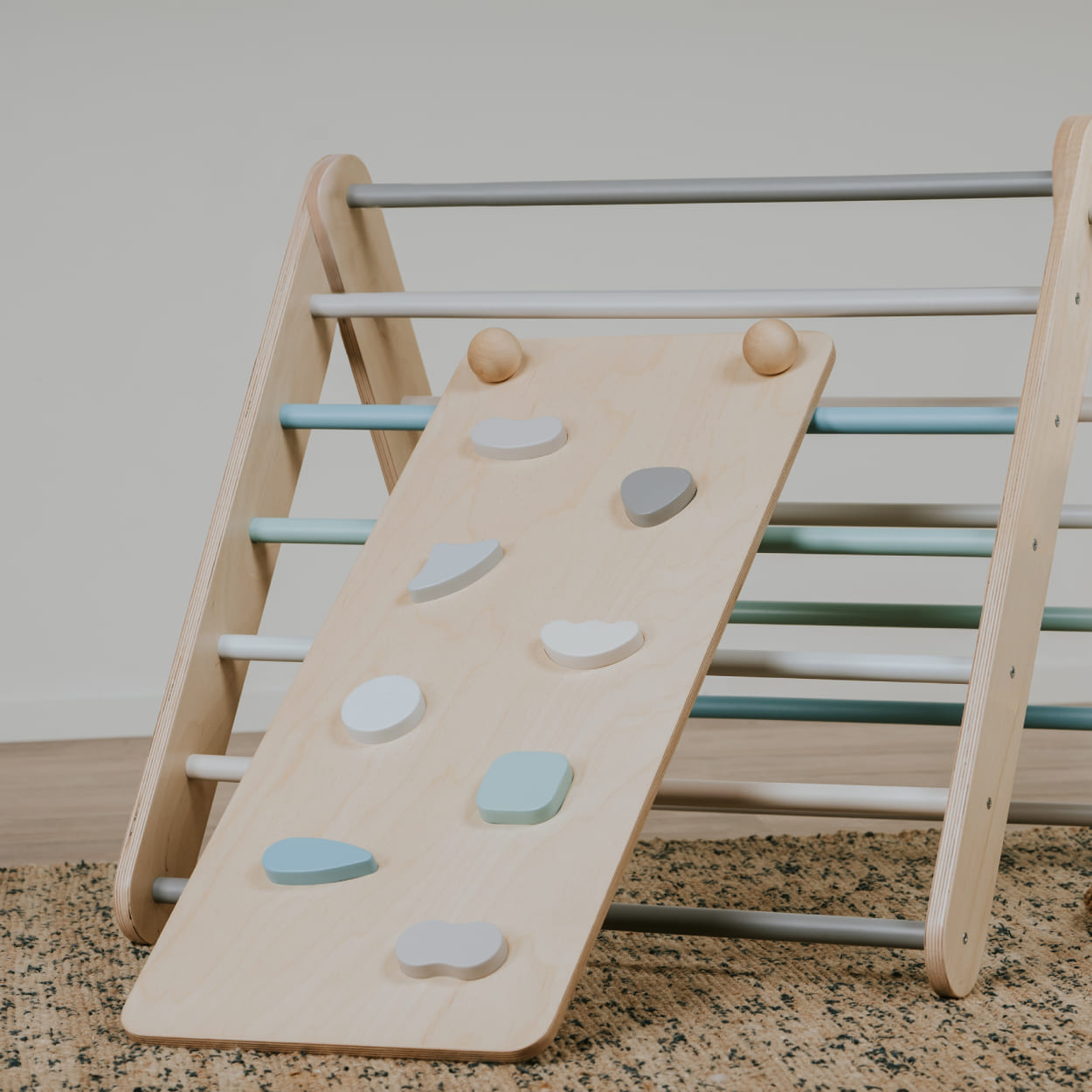 Toddler indoor gym triangle with a ramp.