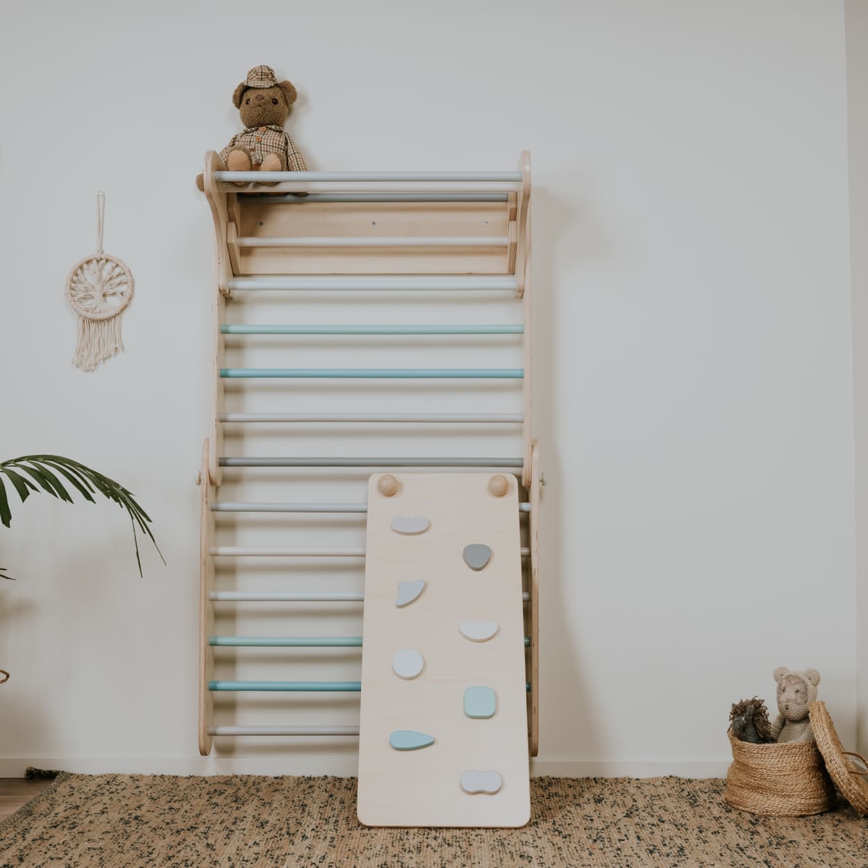 Children room Swedish wall climbing gym with a ramp in pastel color theme.