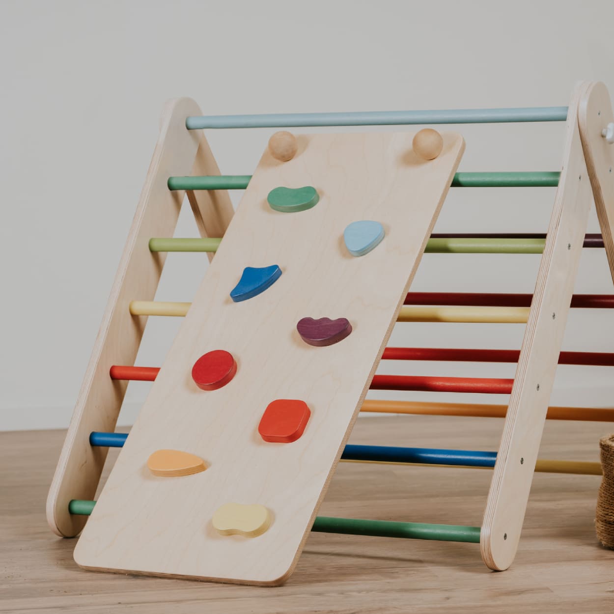 Wooden climbing gym set with a ramp for toddlers