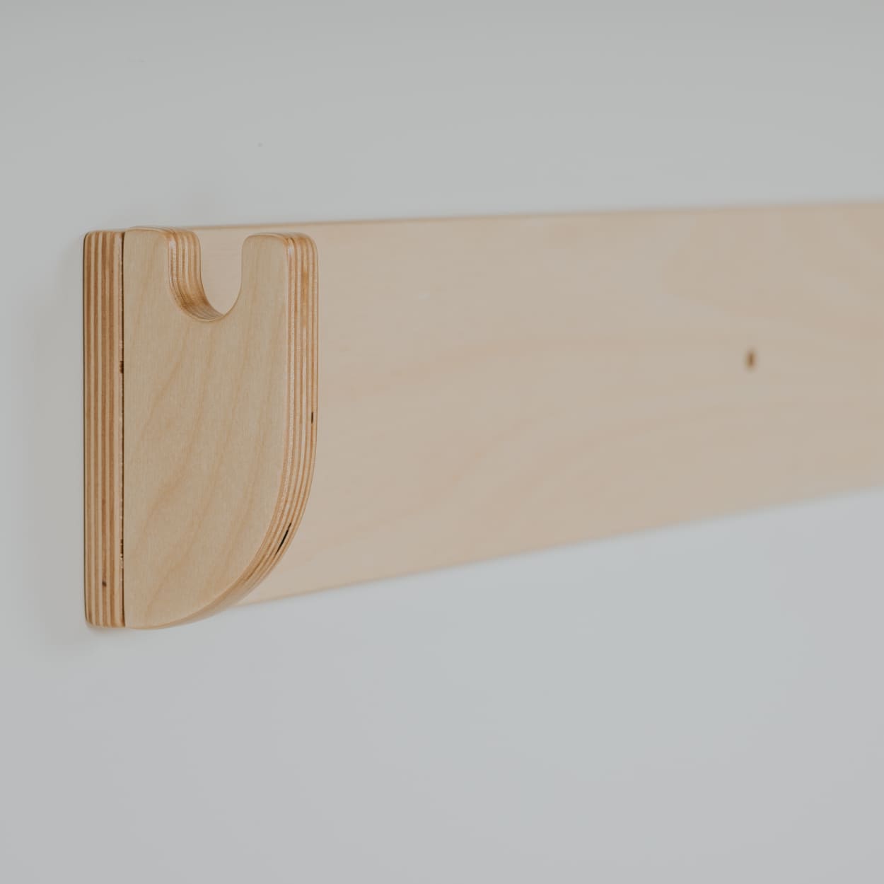 Hanger piece of leg&go swedish ladder wall set made from wood. 