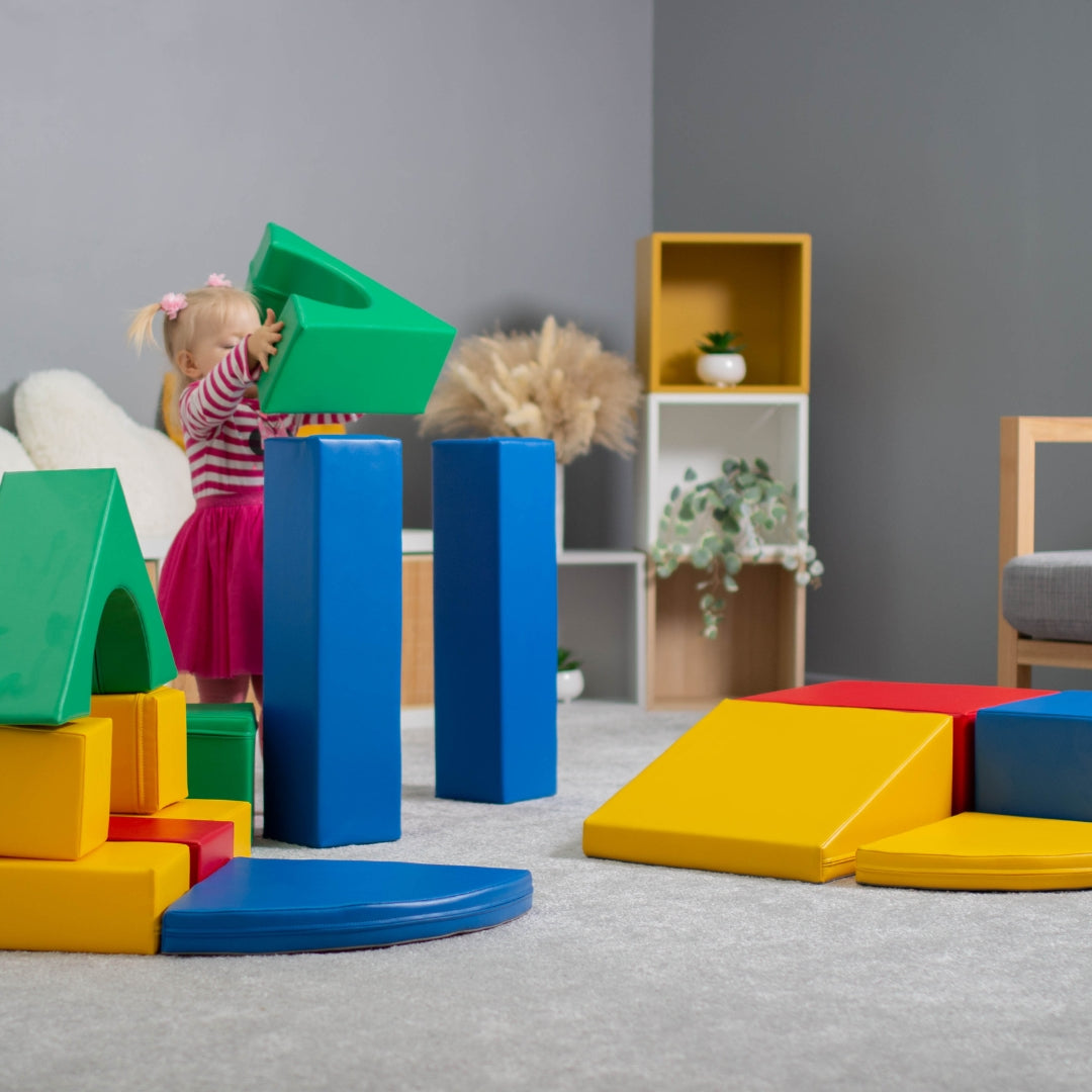 Girl building a creative structure using multicolor Creativity soft play blocks