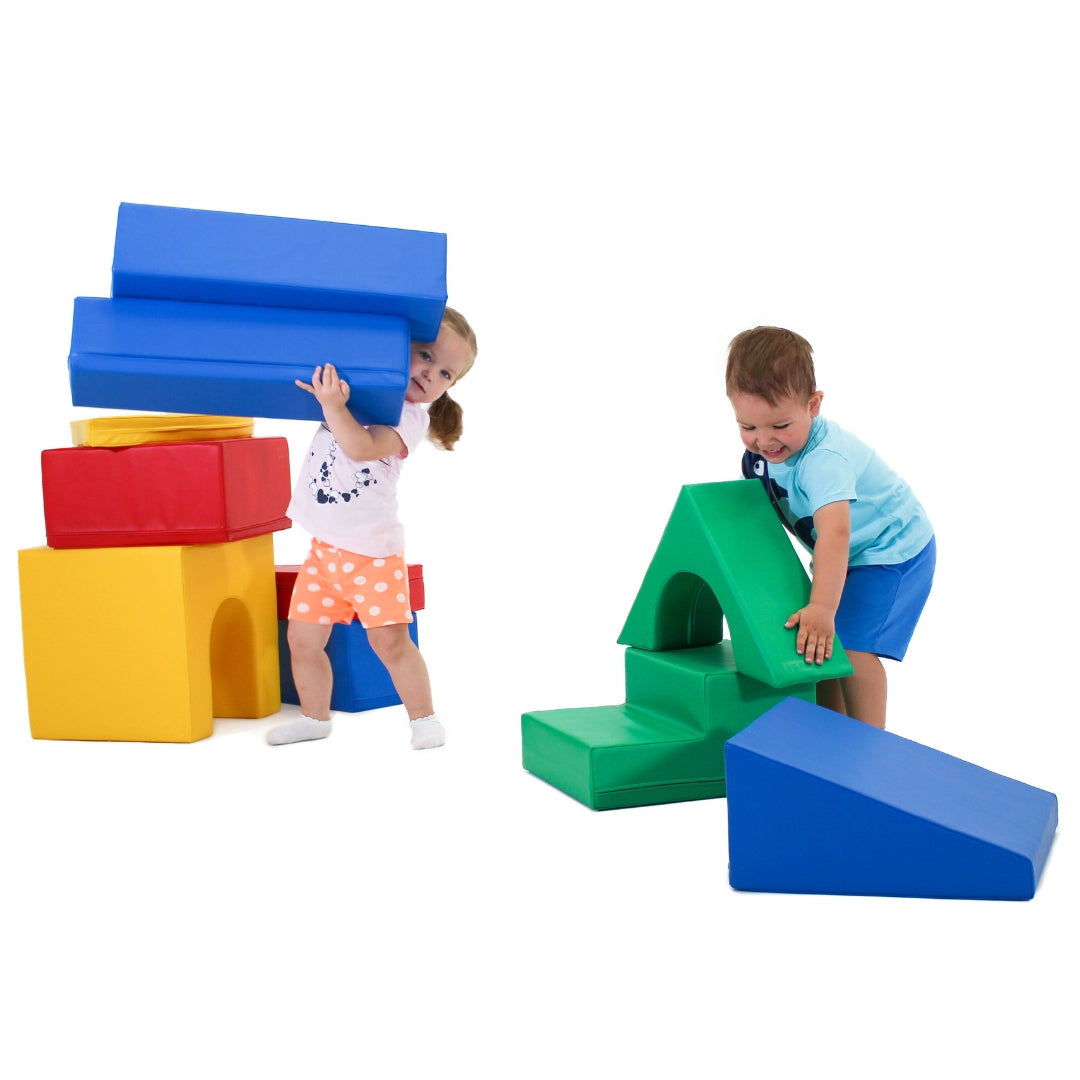 Girl and boy playing together and building structures with multicolor Creativity soft foam blocks