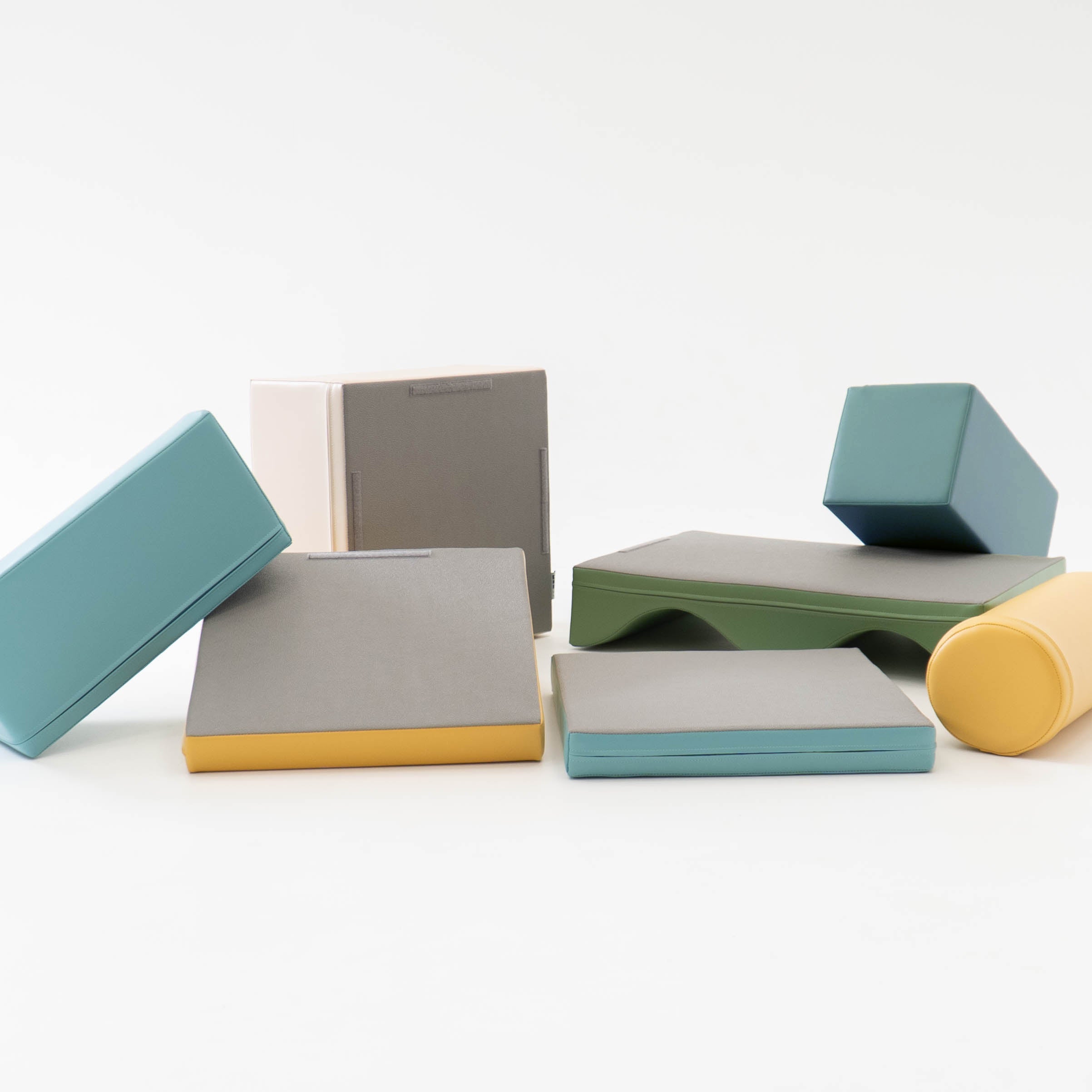 Beige turquoise Discoverer soft play set laid out on white background with mix of block shapes
