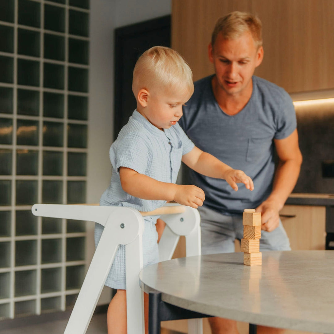 Father and toddler playing together using Leg&Go Foldable Helper Tower White