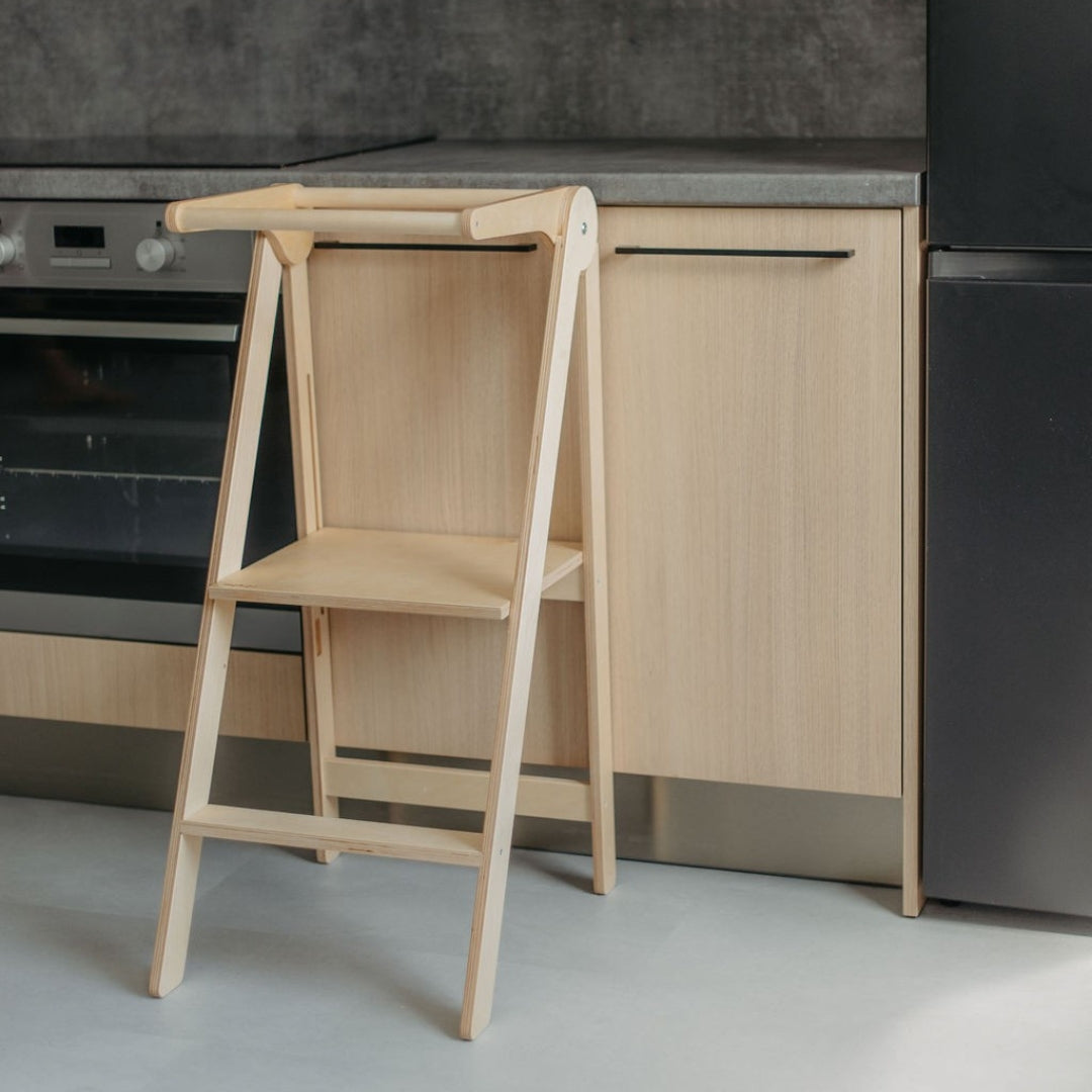 Natural wooden kitchen tower, designed for children to safely reach the countertop