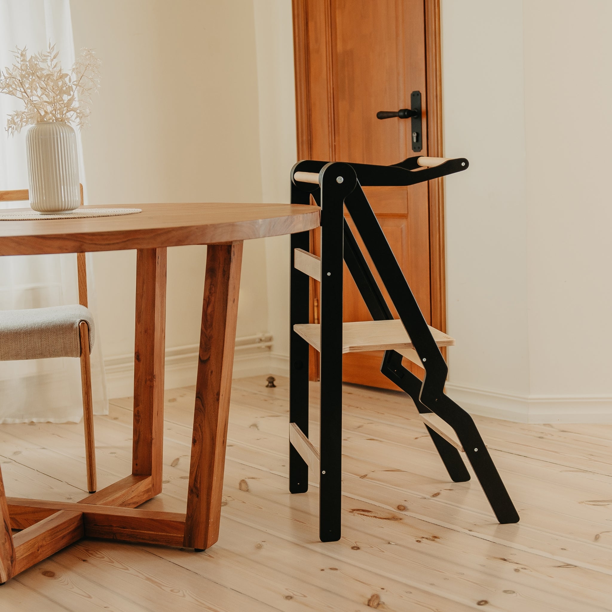 black foldable kitchen tower for toddler independence and learning