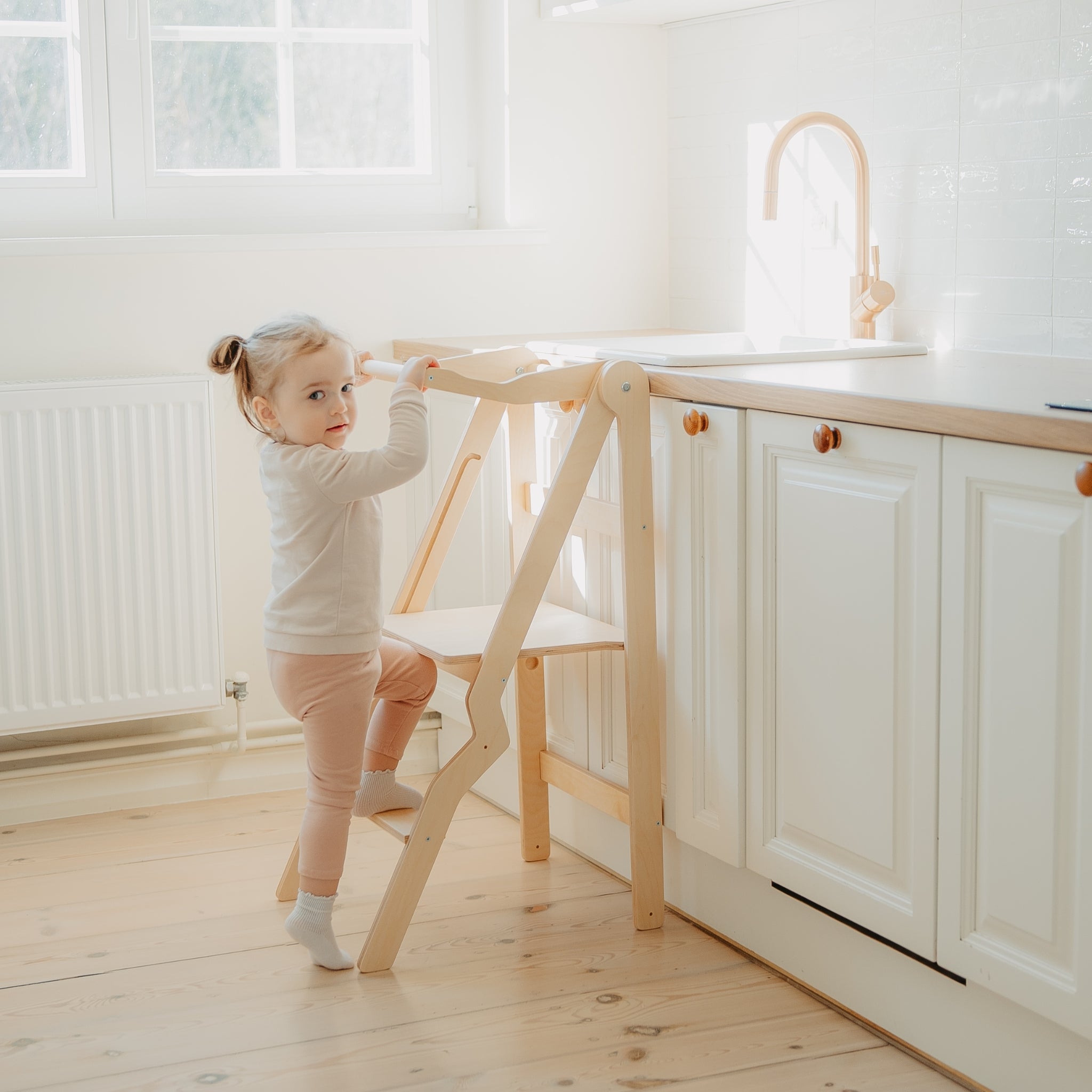 natural wooden kitchen tower for toddlers helping at counter
