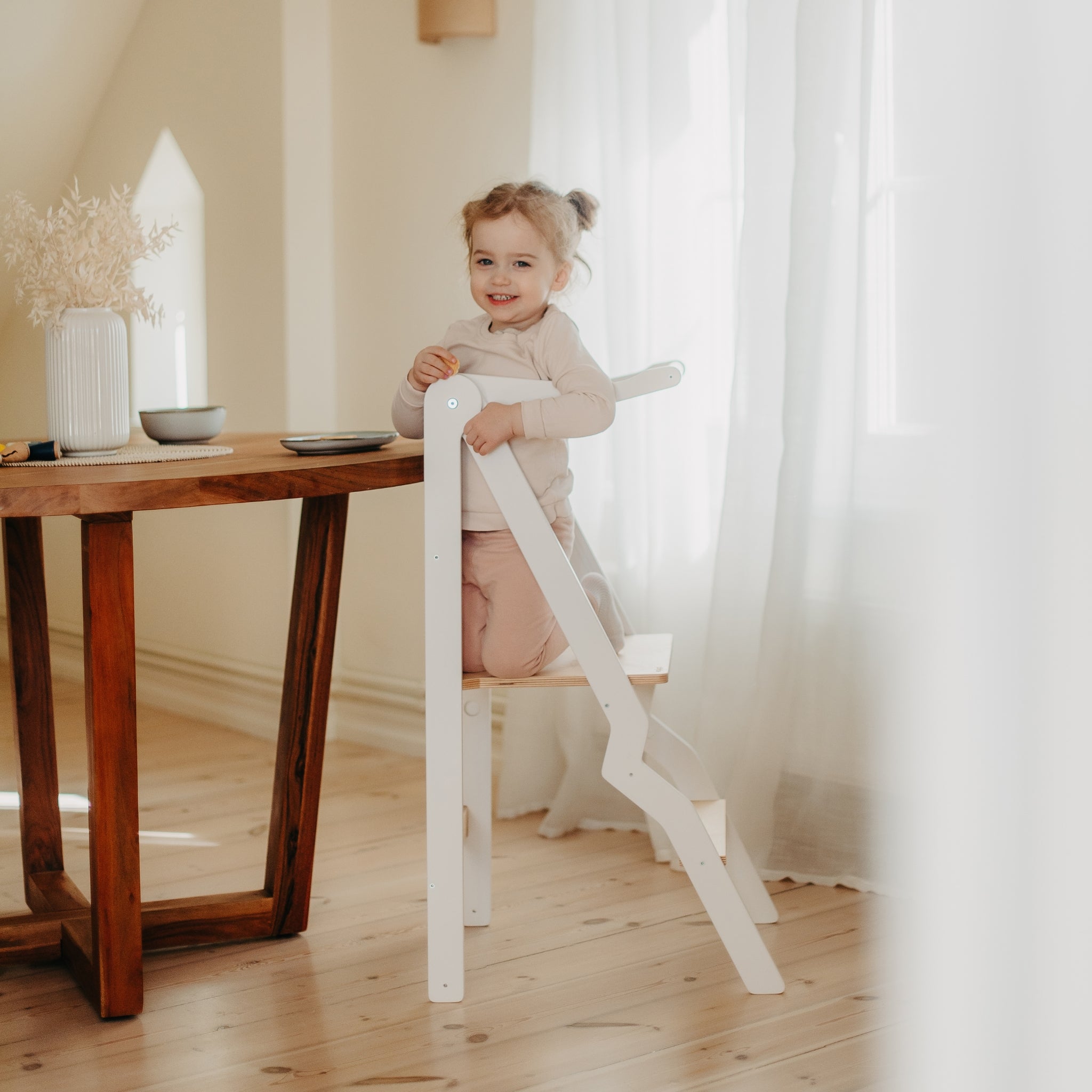 white foldable learning tower for toddler kitchen activities