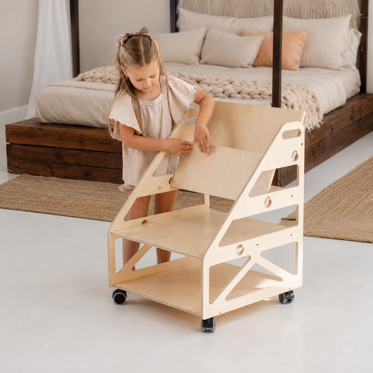 Natural wood Montessori bookshelf displaying children’s books with covers facing forward