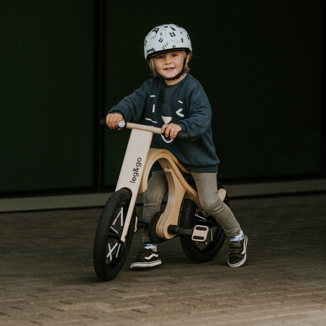 Child on the leg&go balance bike with pedal bike add on