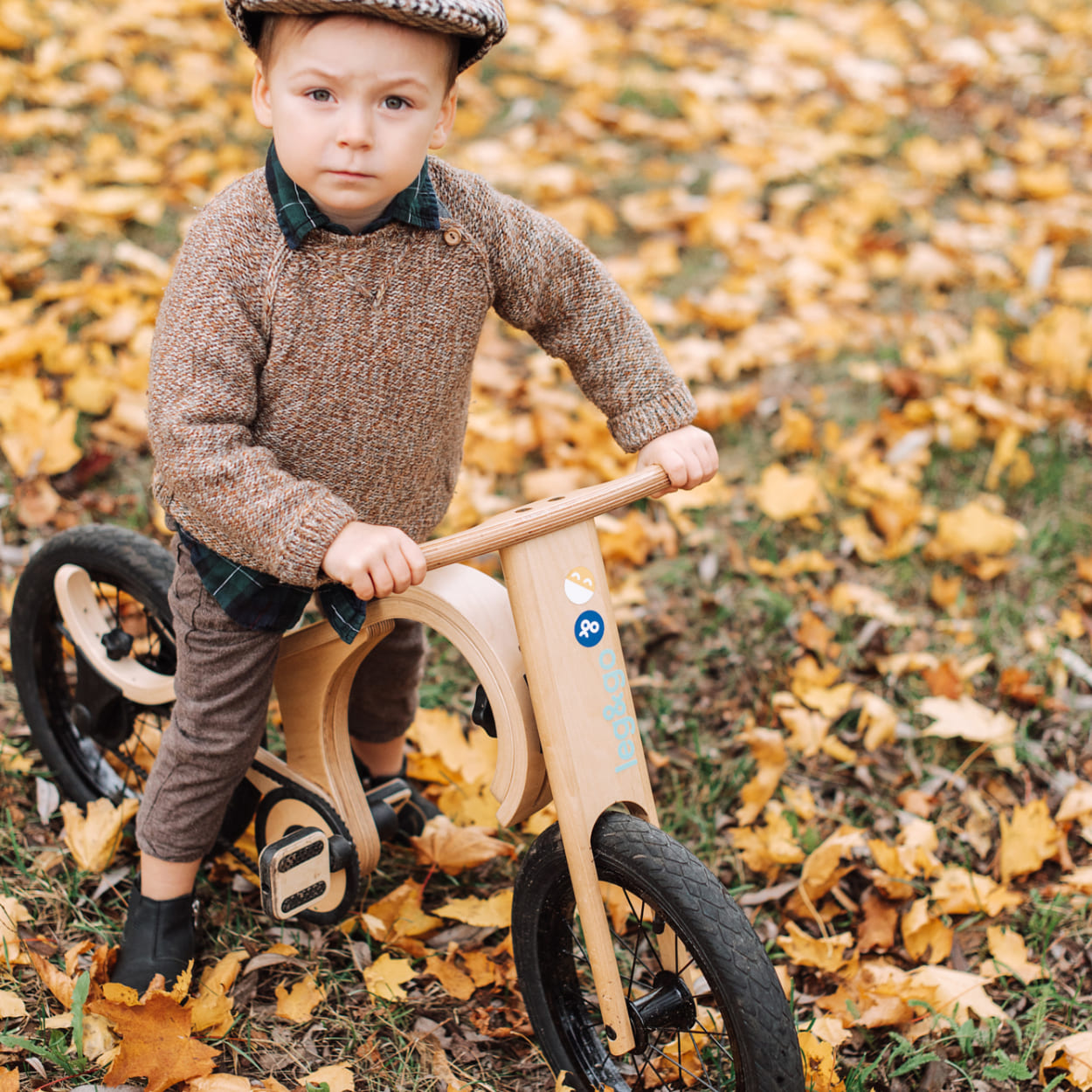 boy relaxing on a pedal bike in during autumn