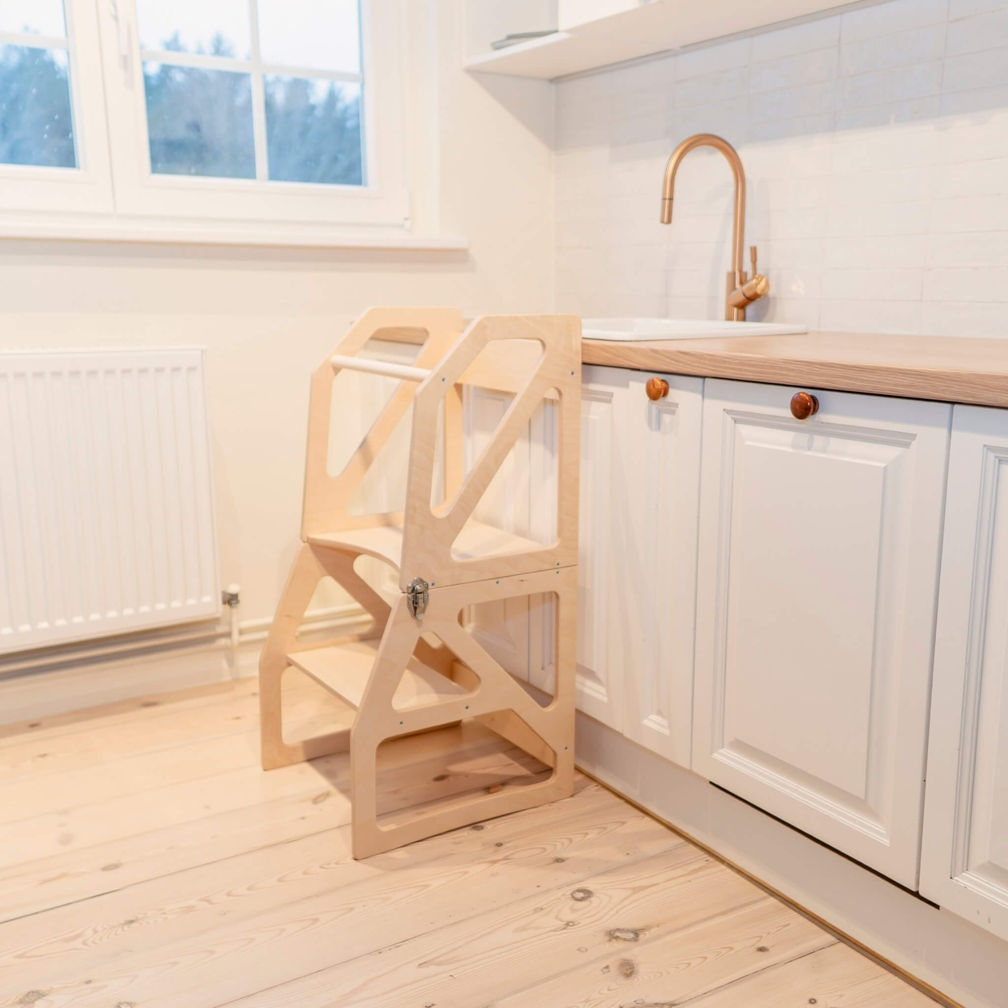 Natural wood transformable kitchen tower in adjustable standing positio