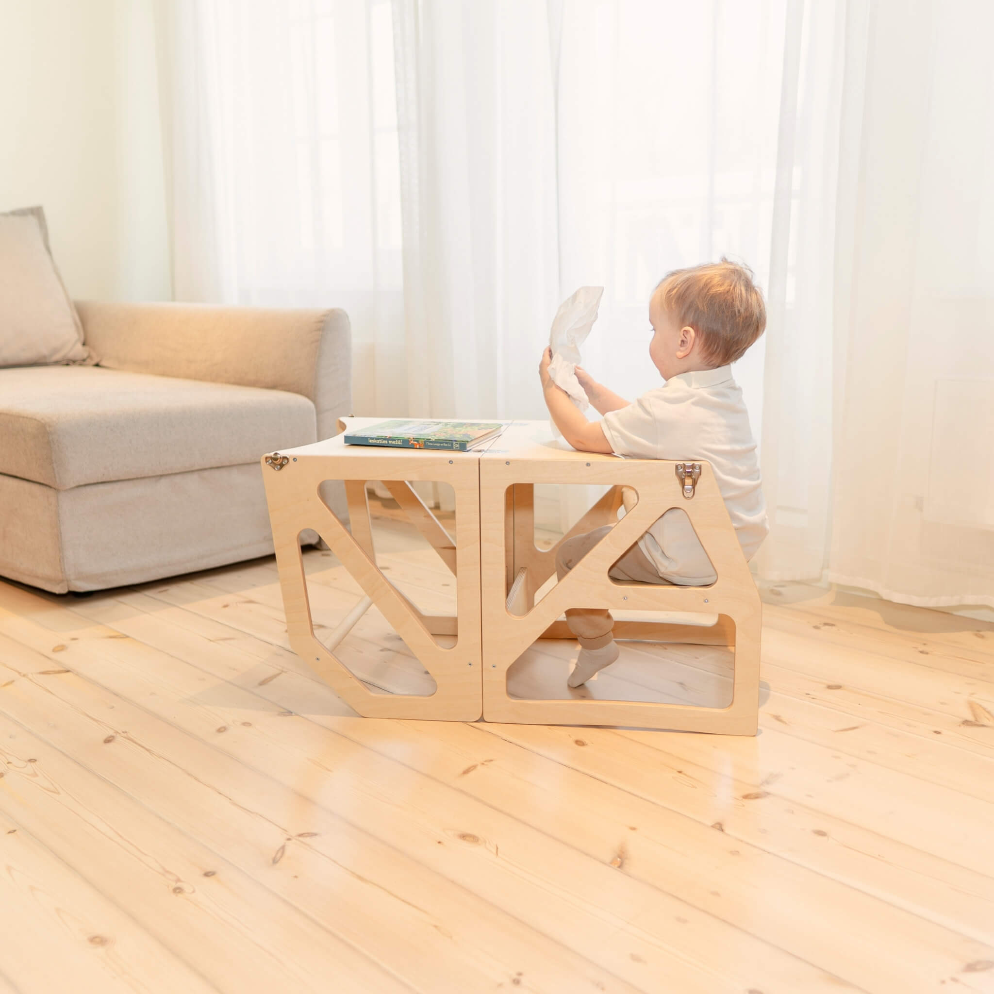 Natural wood transformable kitchen tower converted into toddler table and chair
