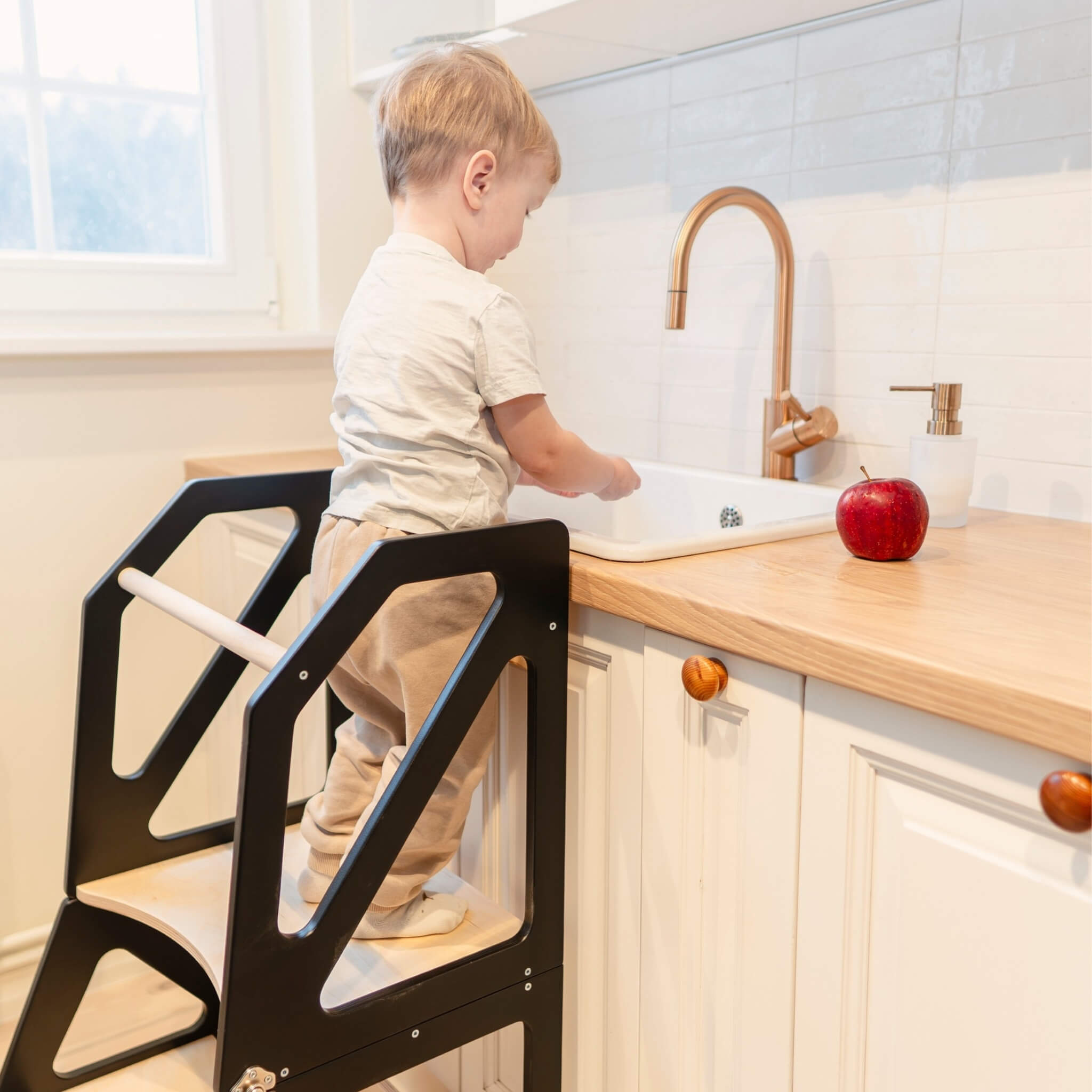 Convertible black kitchen tower in standing mode at kitchen counter