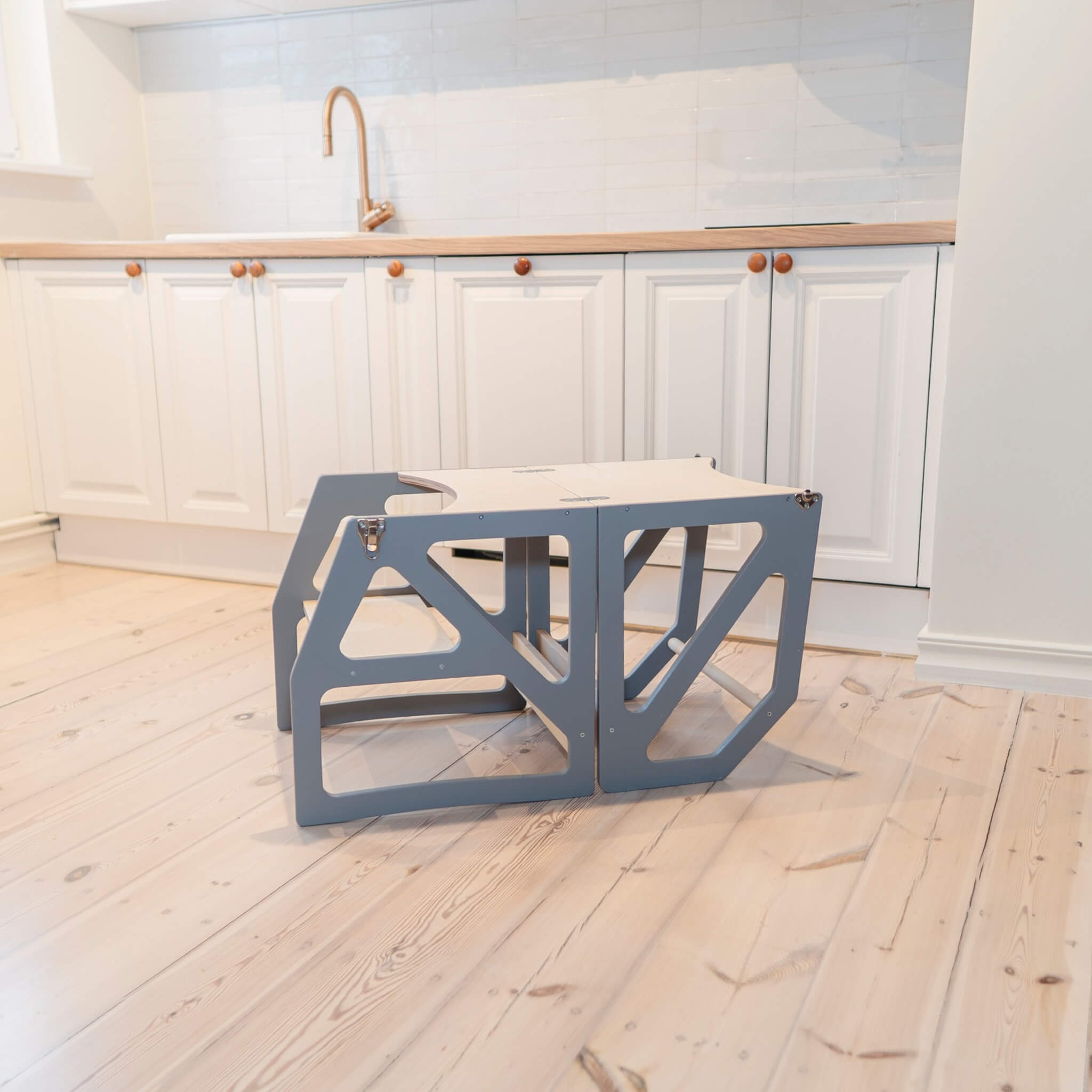 Grey adjustable kitchen tower in table and chair configuration