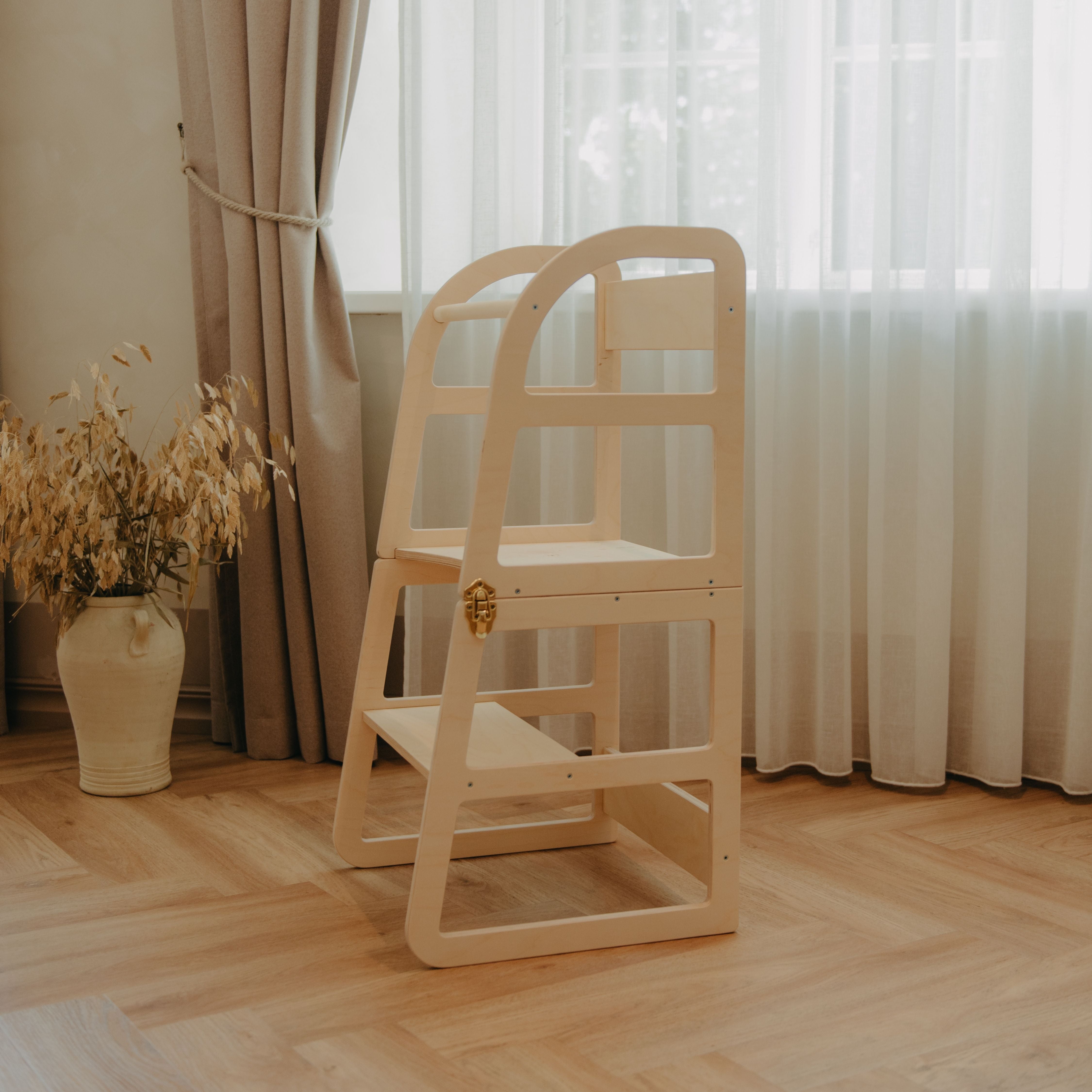 Natural wooden transformable kitchen tower for toddlers displayed for home use and independent learning