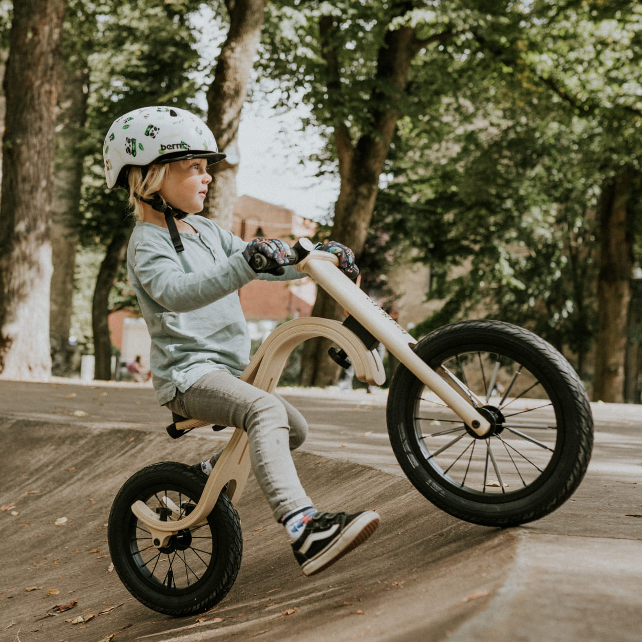 Toddler riding a balance bike by leg&go brand