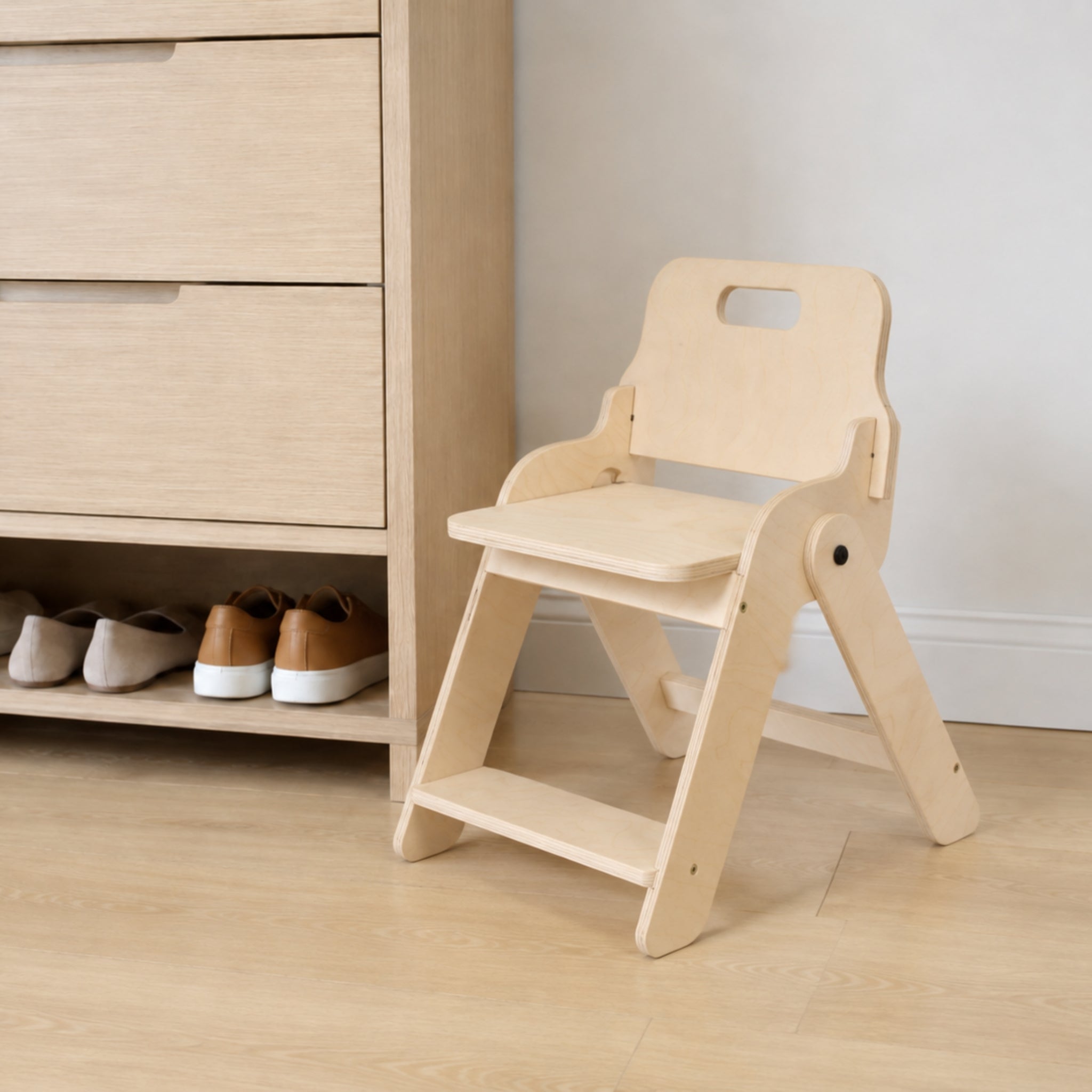 Wooden foldable kids chair with a supportive backrest in a modern home