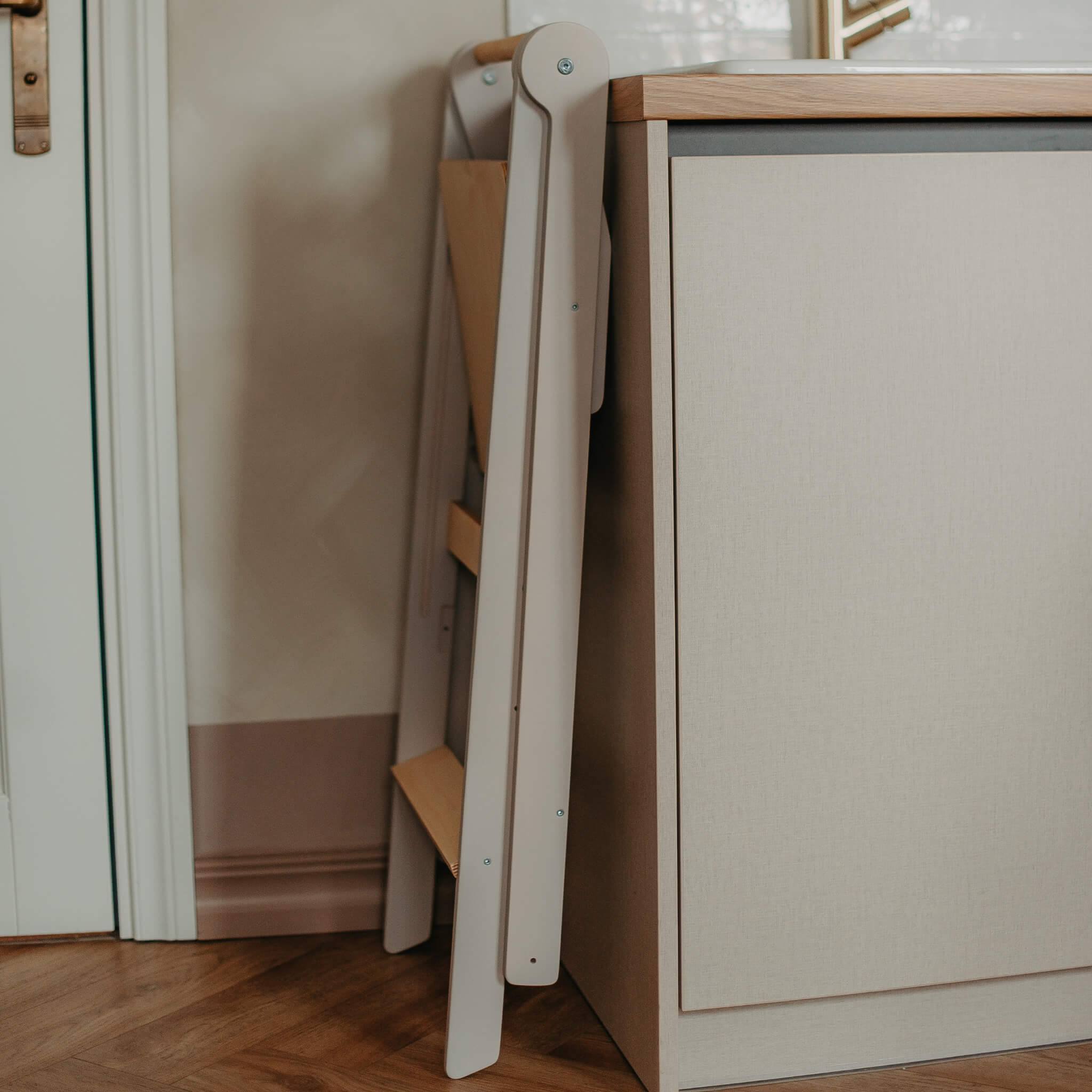 Foldable learning tower folded flat for easy and space-saving storage