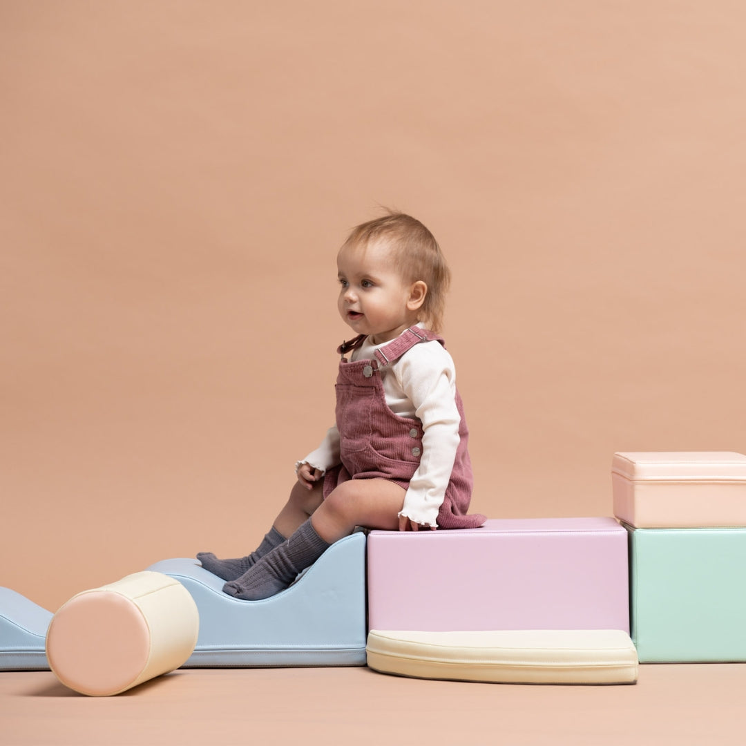 Girl playing with light pastel Explorer soft blocks