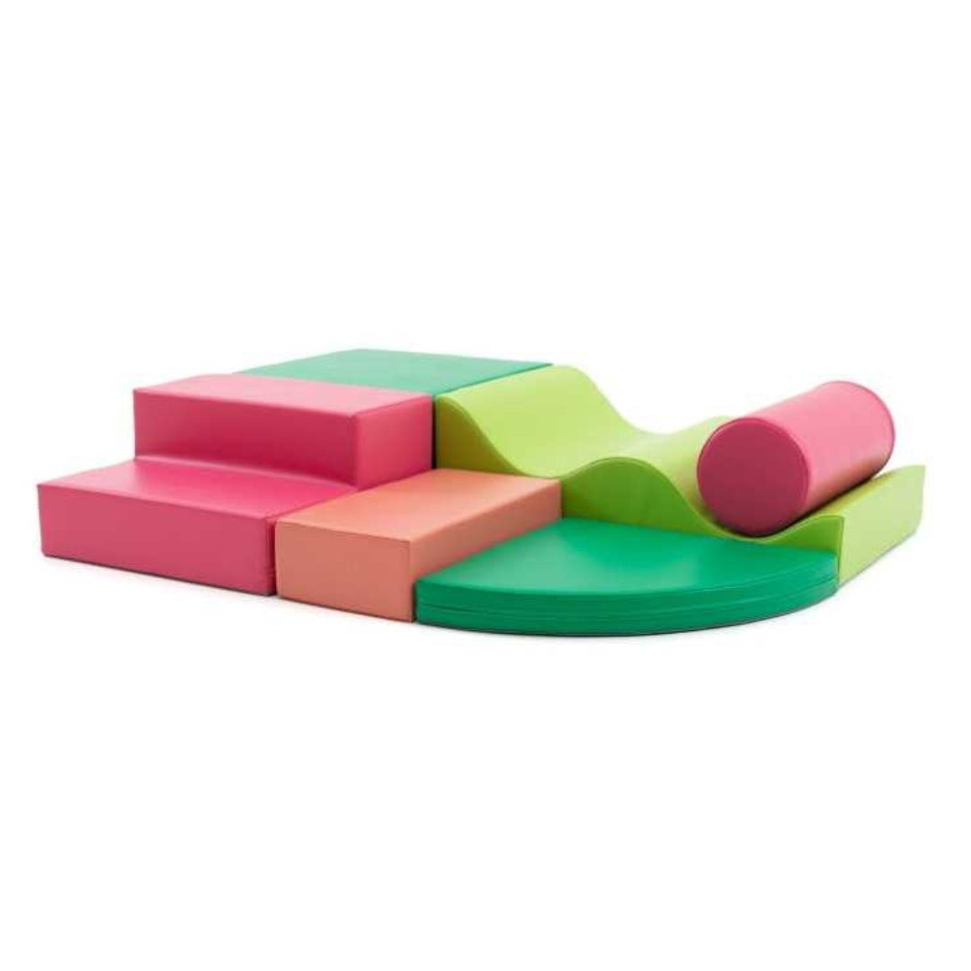 Colorful Explorer soft play blocks in pink and green tones arranged in a compact layout