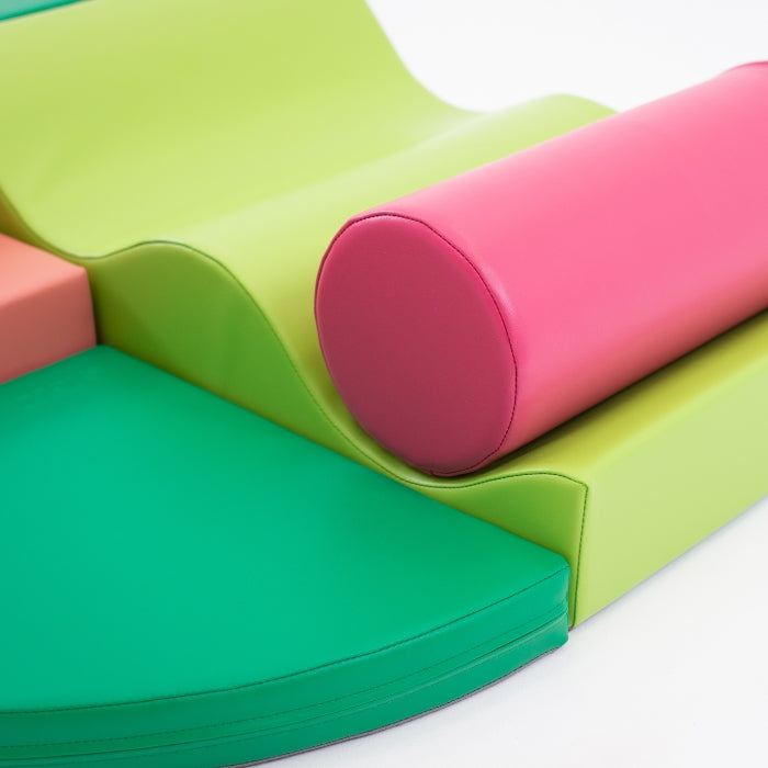 Close-up of Explorer soft play blocks in pink and green shades