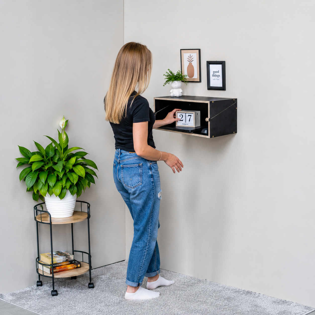 Black Murphy Desk closed as a floating wall shelf in a modern interior