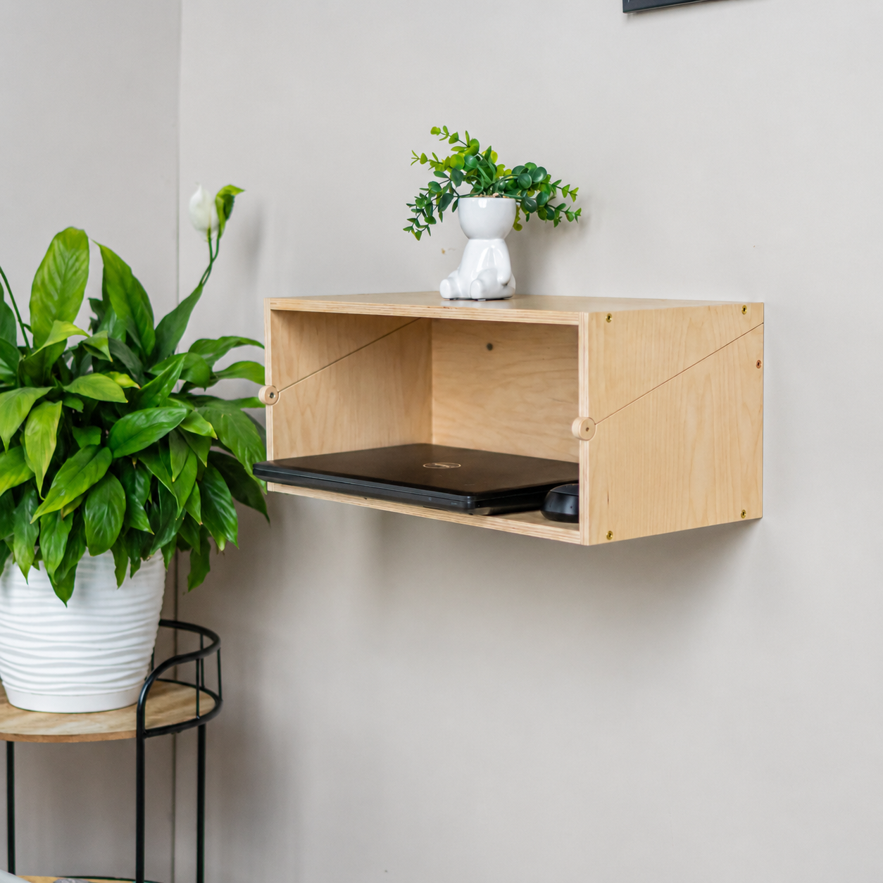 Natural wood Murphy Desk folded as a floating storage shelf
