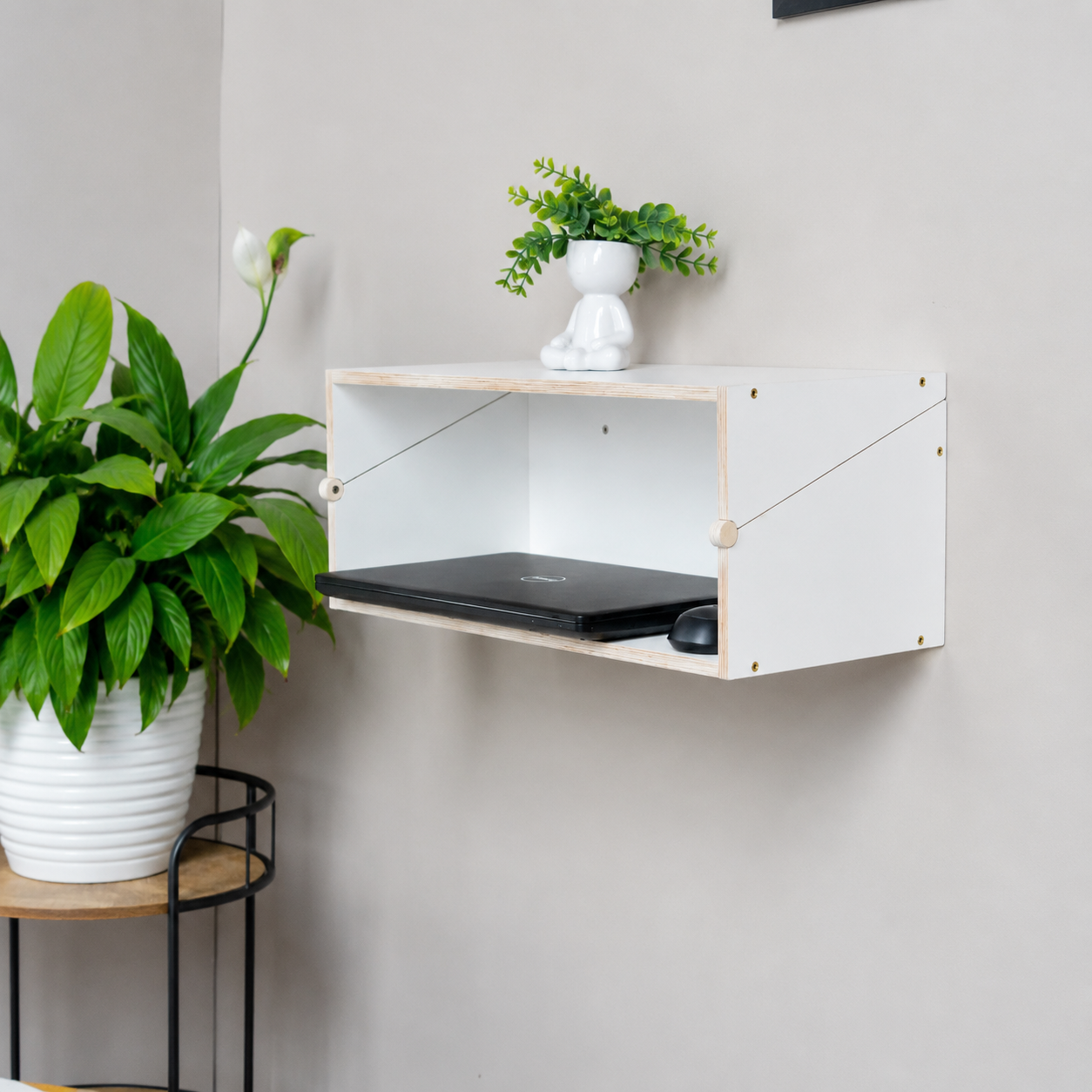 White Murphy Desk folded into a stylish floating wall shelf
