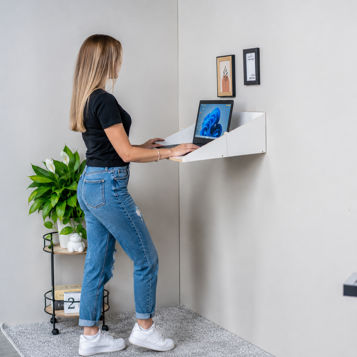 Standing desk setup using a white wall mounted Murphy Desk