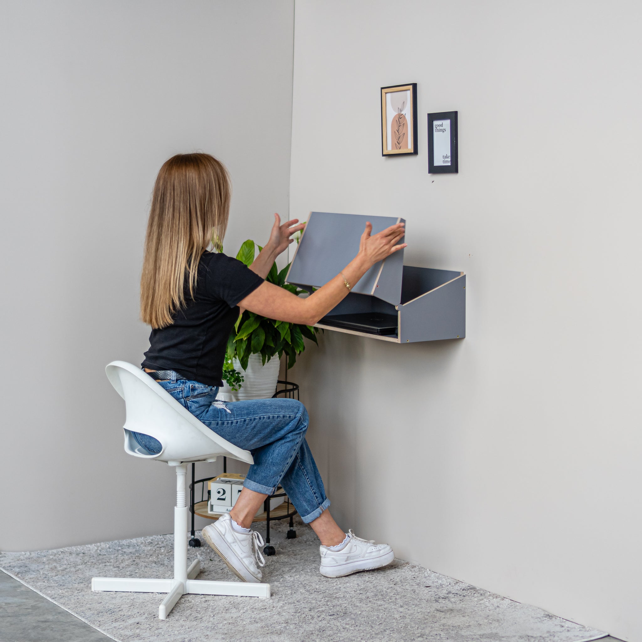 Gray Murphy Desk used as a compact home office wall mounted desk