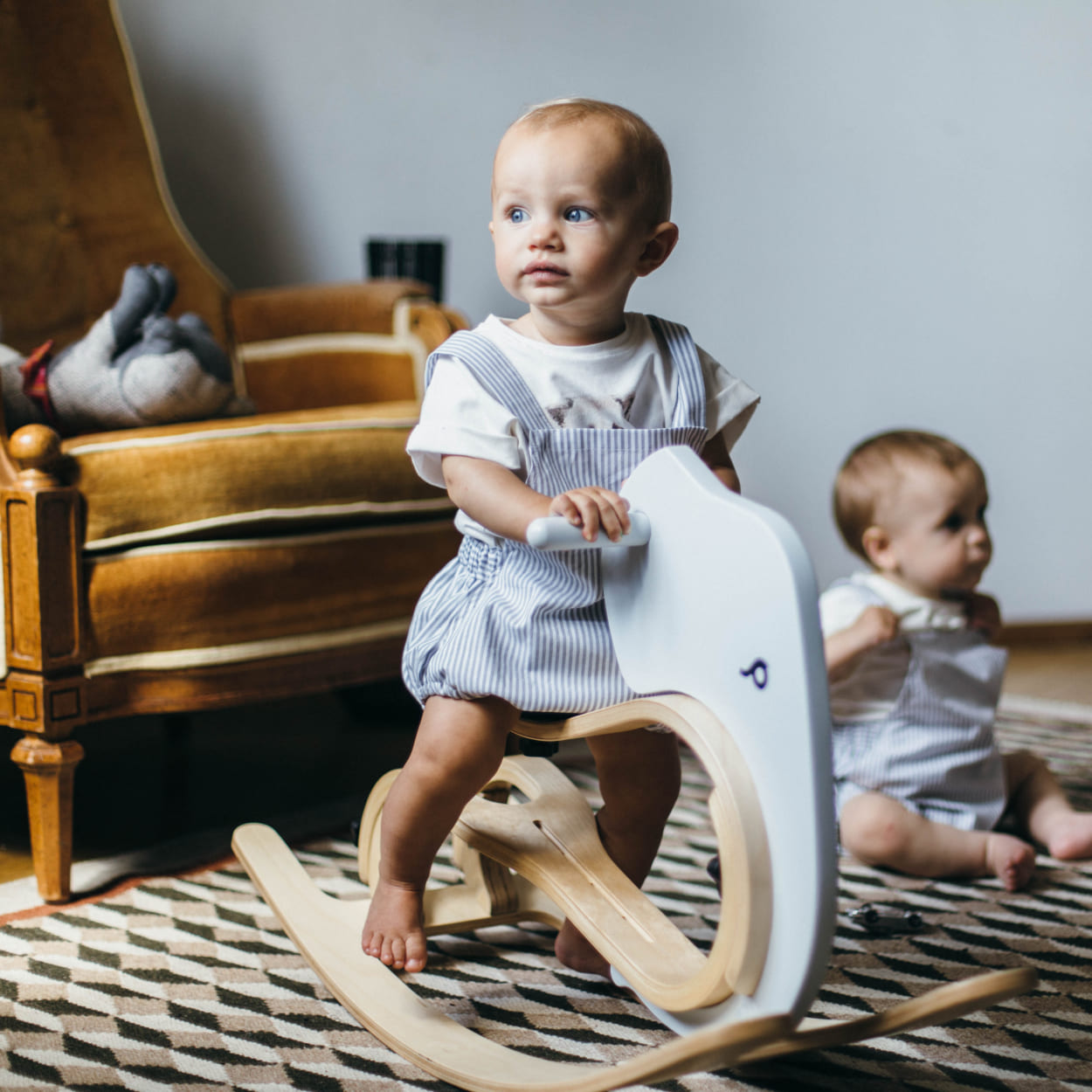 children playing with rocking elephant swing toy