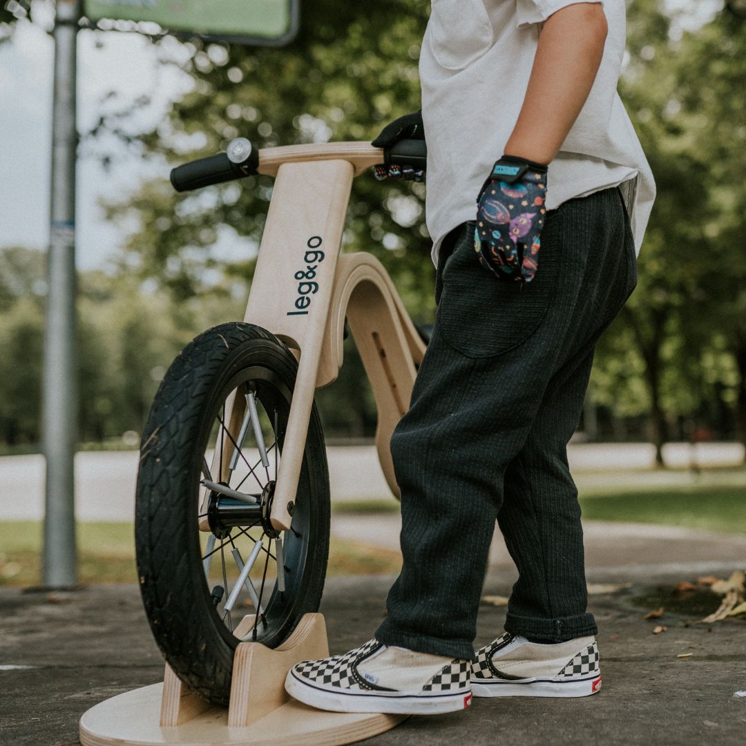 Compact birch wooden stand for balance bike parking