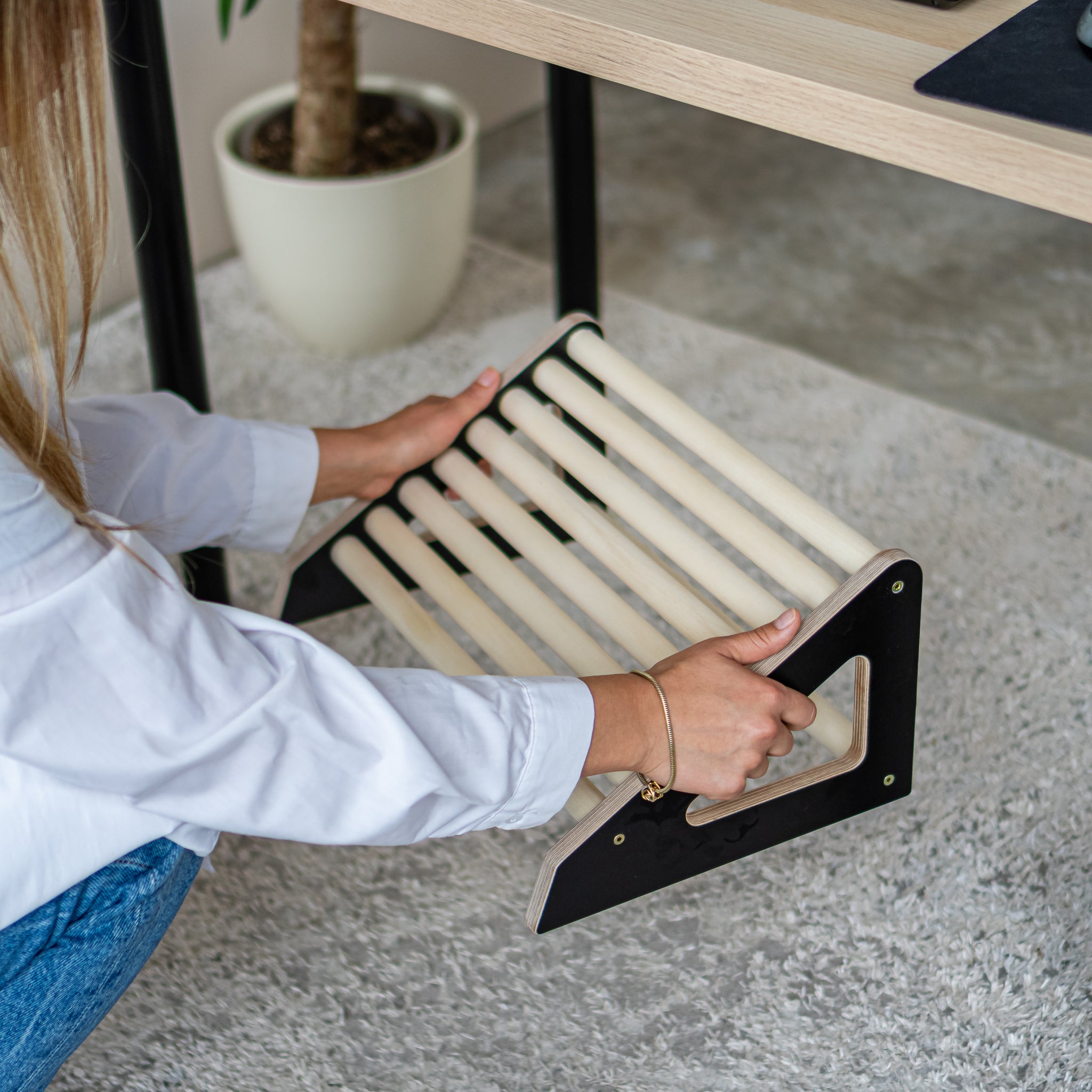Close-up of wooden footrest roller with natural wood rollers