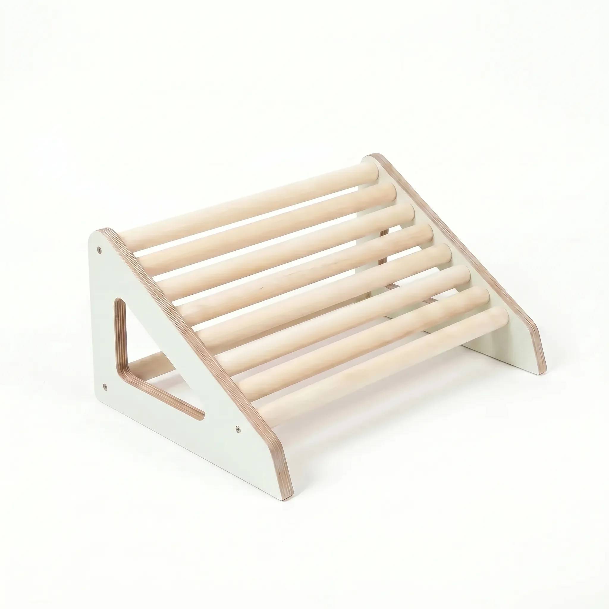 White wooden footrest roller designed for posture support and active sitting